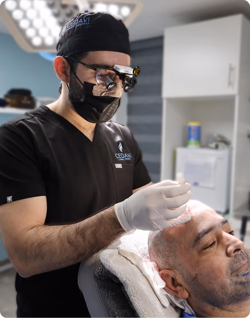 Dr. Villarreal reviewing a patient's hair restoration plan